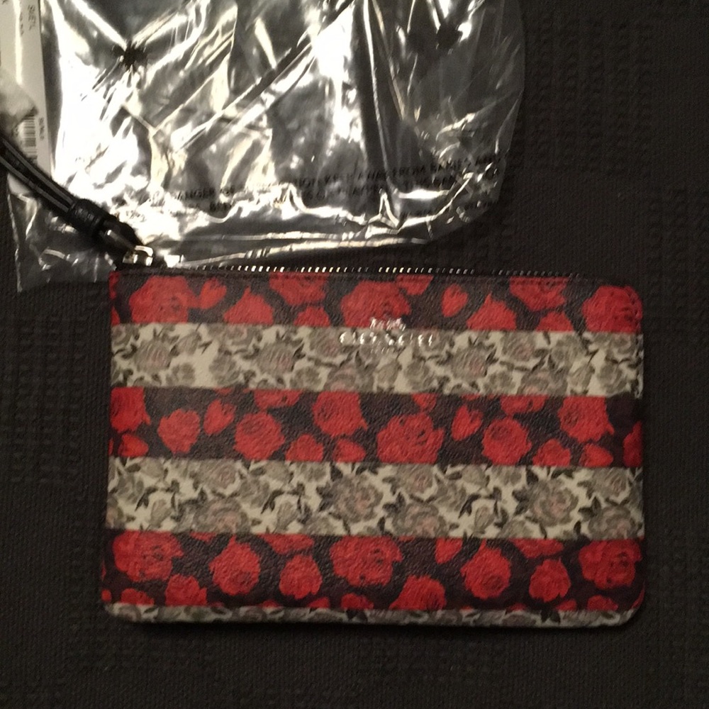 Women's Coach signature corner zip wristlet